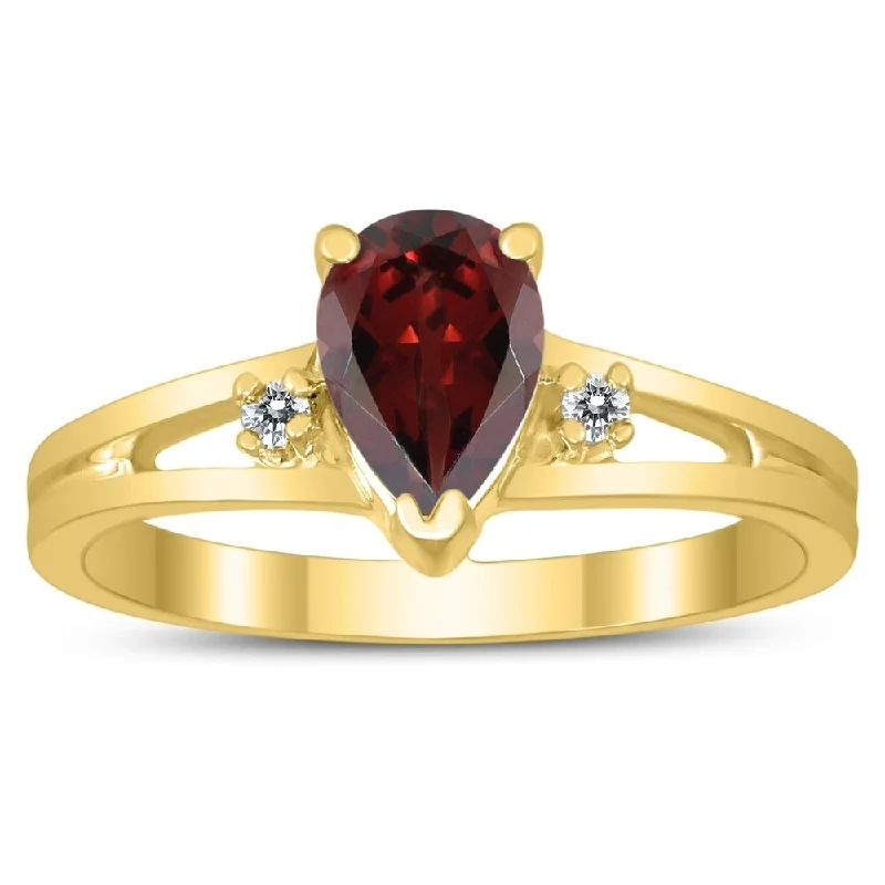 7X5MM Garnet and Diamond Pear Shaped Open Three Stone Ring in 10K Yellow Gold