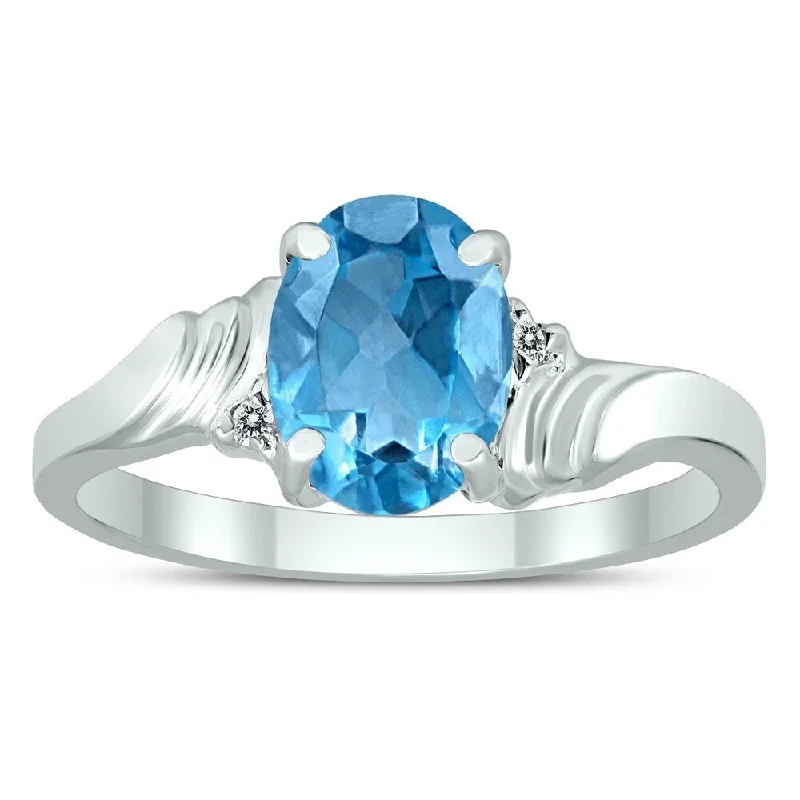 8X6MM Blue Topaz and Diamond Wave Ring in 10K White Gold