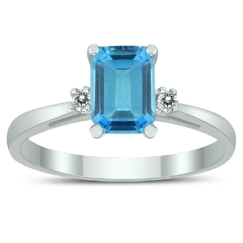 Emerald Cut 7X5MM Blue Topaz and Diamond Three Stone Ring in 10K White Gold